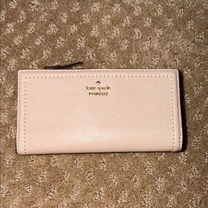 kate spade large slim bifold wallet in Light Pink